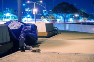 Homeless man sleeps in California